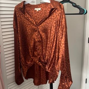 Brown shiny leopard print dress top. Tie front. Long back. Collared